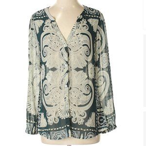 Sheer green-and-white patterned blouse